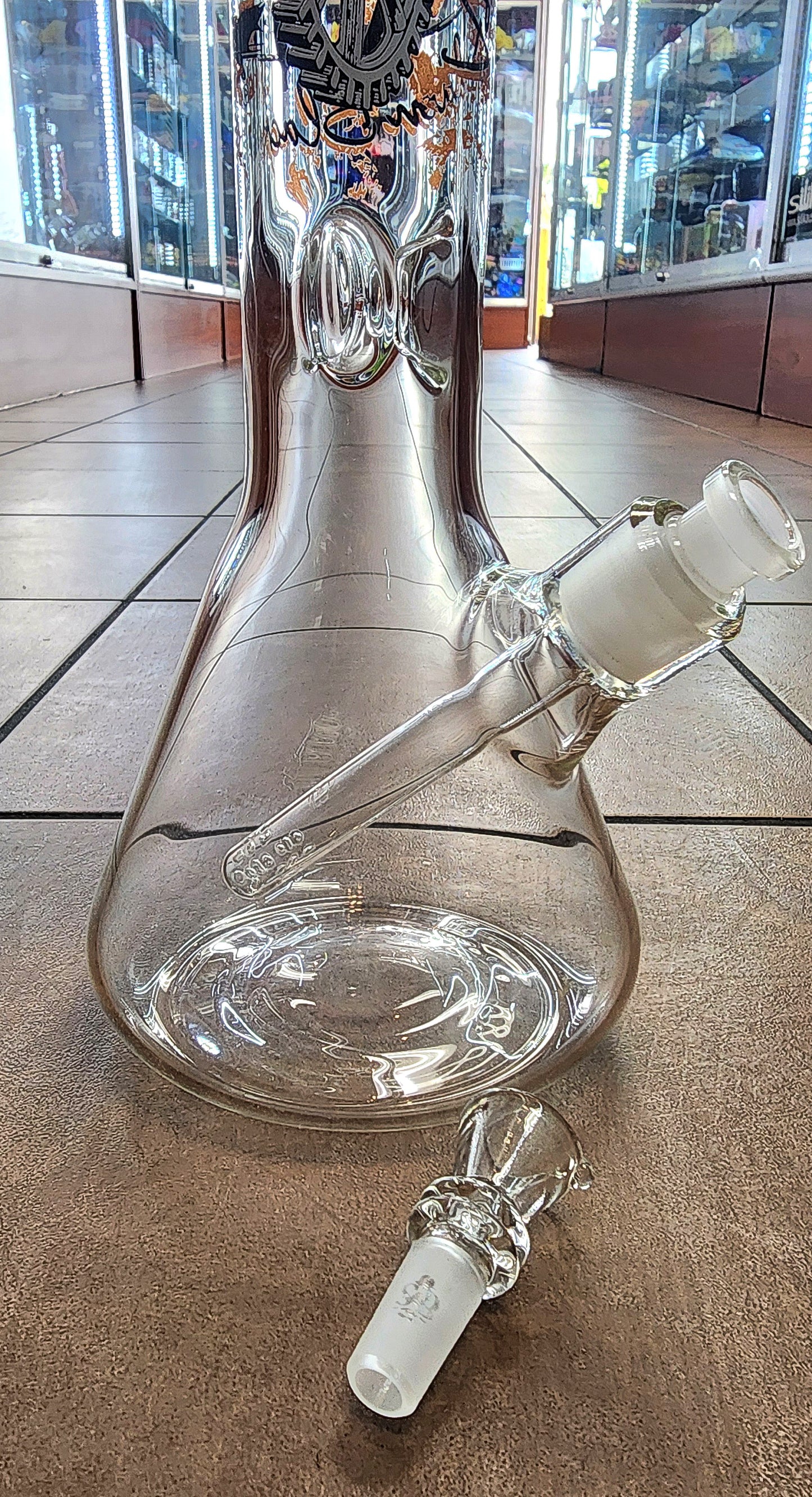 Sheldon Black "Man Balancing w/ Gears" Beaker